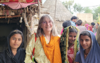 Missionary serving on a Christian mission trip with local children.