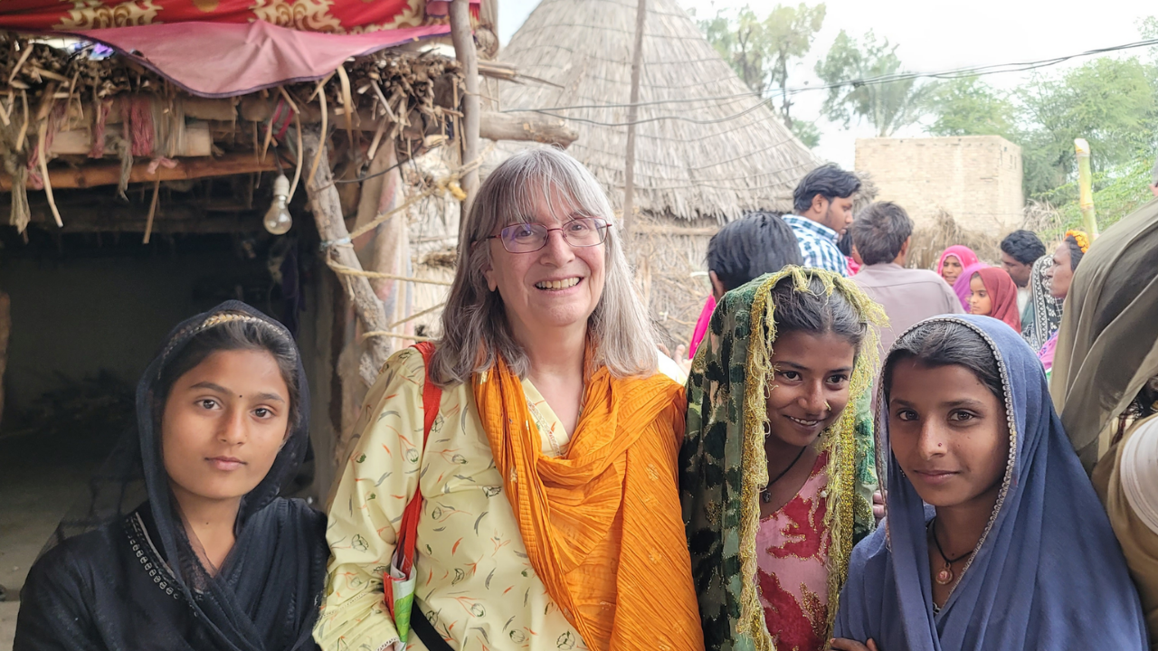 Missionary serving on a Christian mission trip with local children.