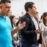 Christian mission team members praying together during a worship gathering.