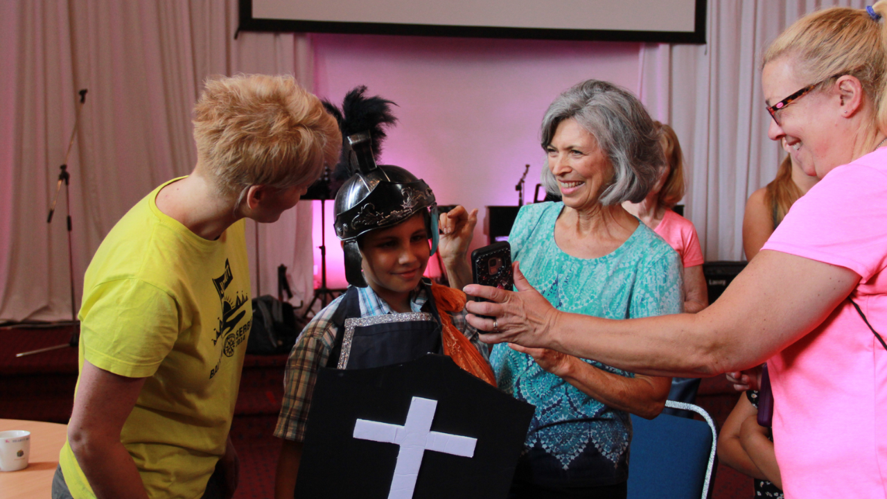 WMA volunteers sharing a joyful ministry moment during an international Christian mission trip.